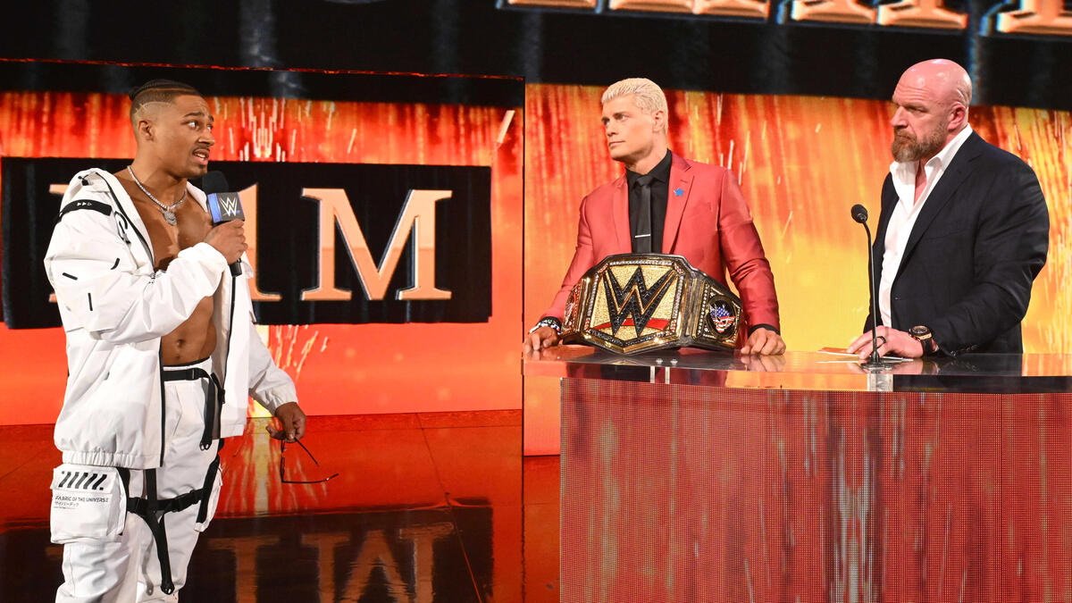 WWE star Carmelo Hayes confronting Cody Rhodes alongside Triple H